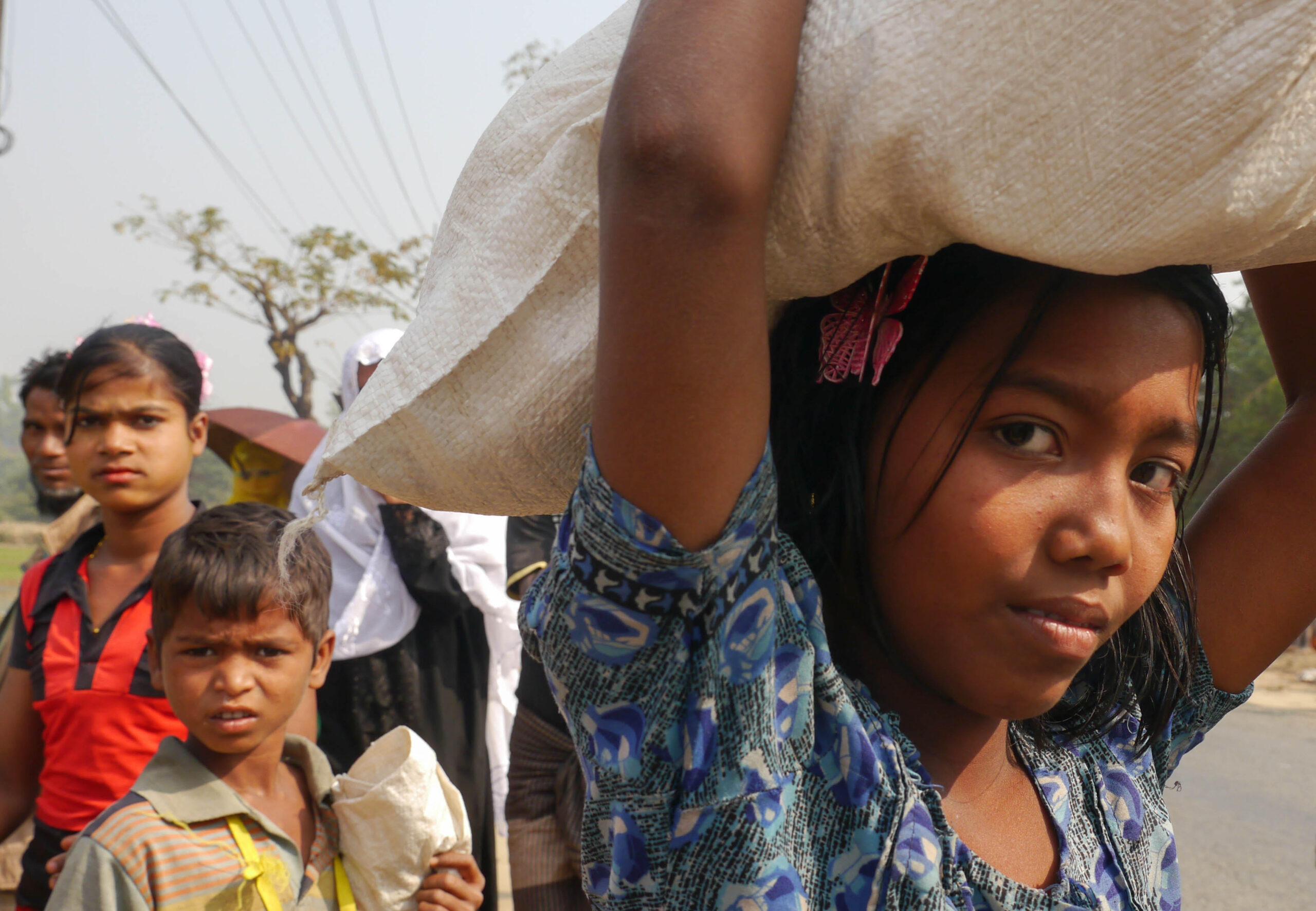 girl carrying supply